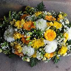 Sunlit Farewell Casket Spray S99